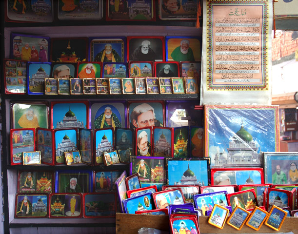 Photograph of Paradise Studio in Barabanki, selling framed images of Waris Ali Shah and his tomb. Image 1 in Tasveer Ghar Image Essay, 'Outside the Imambara: The circulation of devotional images in greater Lucknow', http://tasveerghar.net/cmsdesk/essay/76/