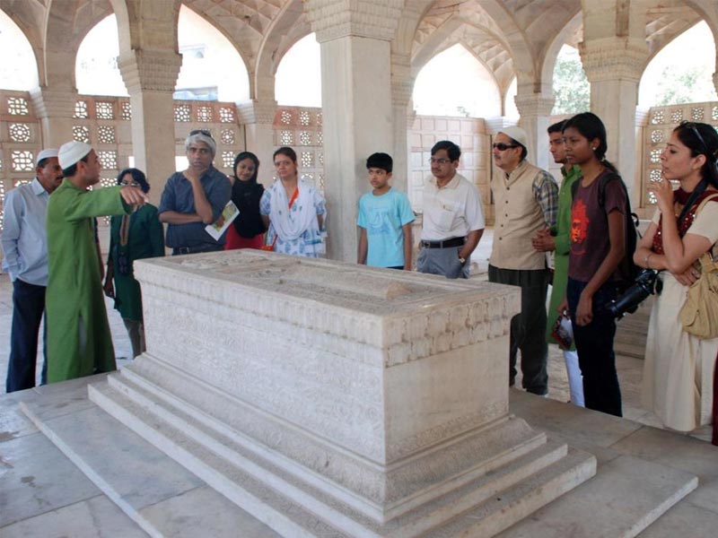 Particiapnts in a heritage walk at the Mughal monument called Chaunsath Khamba (64-pillars) near the shrine of Nizamuddin in New Delhi. Photograph sourced from the Aga Khan Trust for Culture